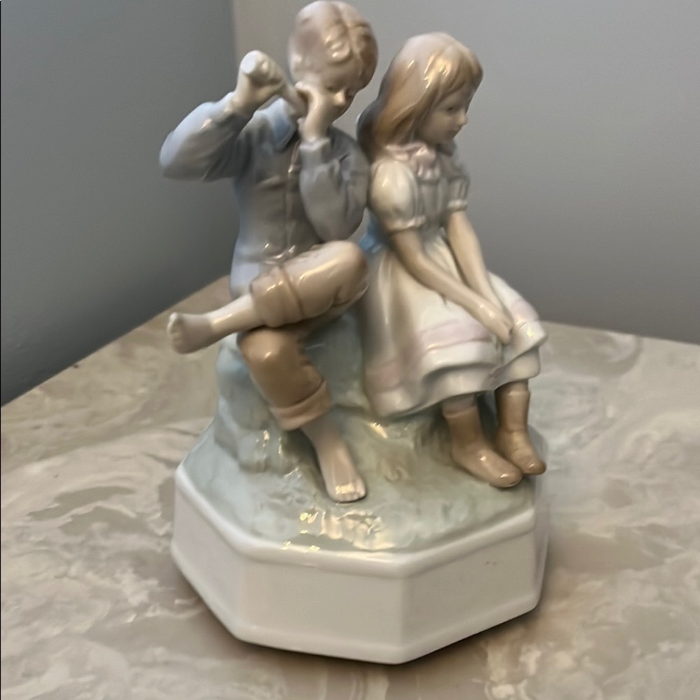 Porcelain Figurine of Boy and Girl
